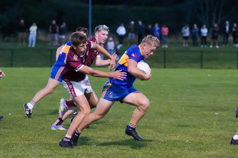 Carrigaline's Diarmuíd Ó Beoláin feeling the pressure from Sé Clarke and Andy Cuthbert of Bishopstown. Picture: Noel Sweeney