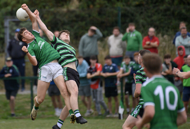  Joe Mouret, Douglas, and Danny Miskella, Ballincollig, contest this high ball. Picture: Dan Linehan