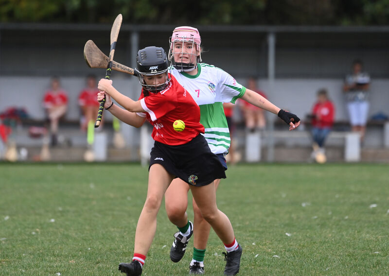  Elannah Sheehan, Seandún, with possession as Sophie Donohoe, Muskerry, attempts a hook. Picture: Larry Cummins