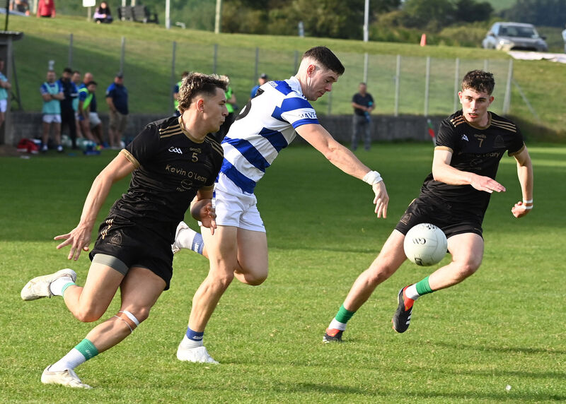 Castlehaven's Rory Maguire has Valley Rovers Adam Walsh-Murphy and Eoin Guinane for company. Picture: Martin Walsh