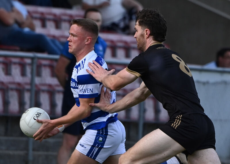 Castlehaven's Jamie O'Driscoll about to be tackled by Chris O'Leary of Valley Rovers. Picture: Martin Walsh