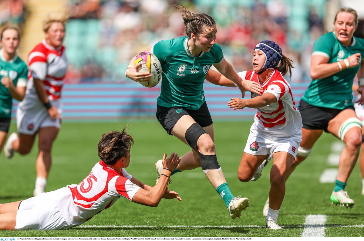 Eve Higgins of Ireland is tackled by Japan players Sora Nishimura, left, and Moe Tsukui. Pic: Harry Murphy/Sportsfile