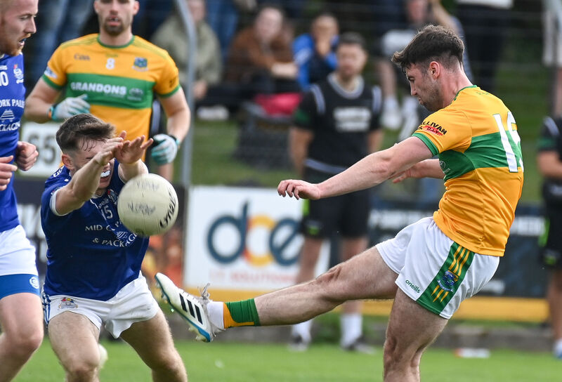  Glanmire's James Crowley has his shot blocked by Ed Ó Mír, Naomh Abán, during their Premier IFC clash at Coachford. Picture: David Keane.