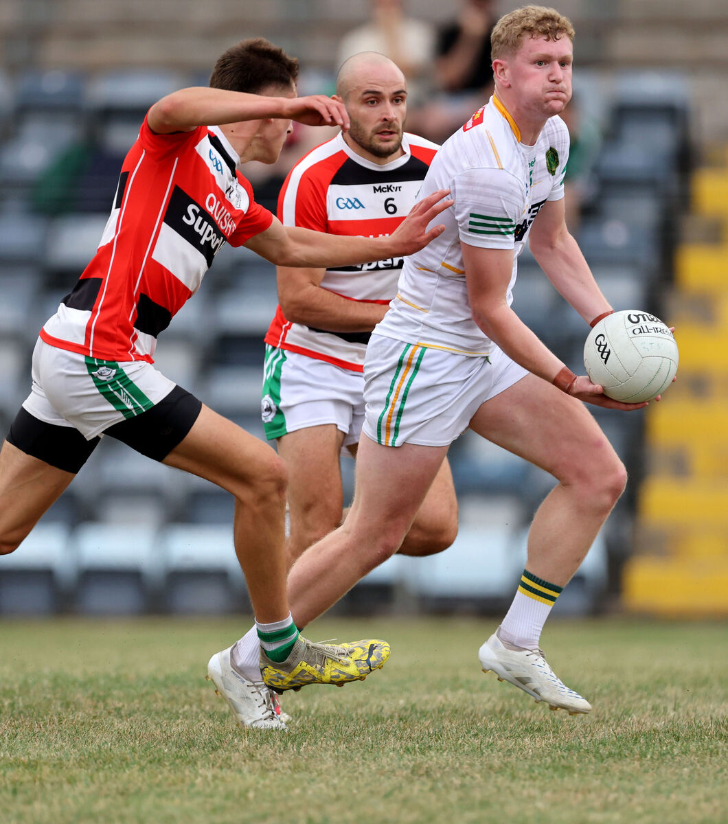  Ben O'Connell and Frank Down, Ballincollig, tracking Rory O'Shaughnessy, St Michael's. Picture: Jim Coughlan.
