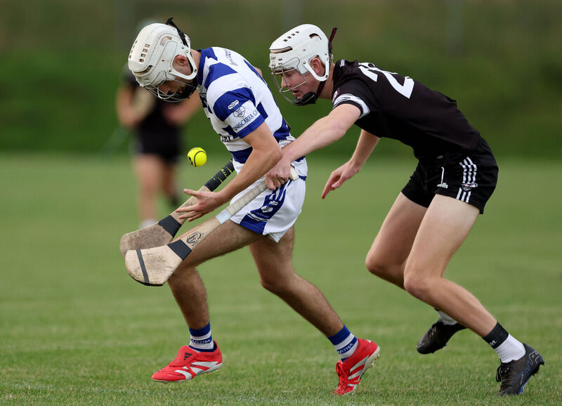  Sean Óg Holland of Inniscarra under pressure from Shane O'Mahony of Midleton. Picture: Jim Coughlan