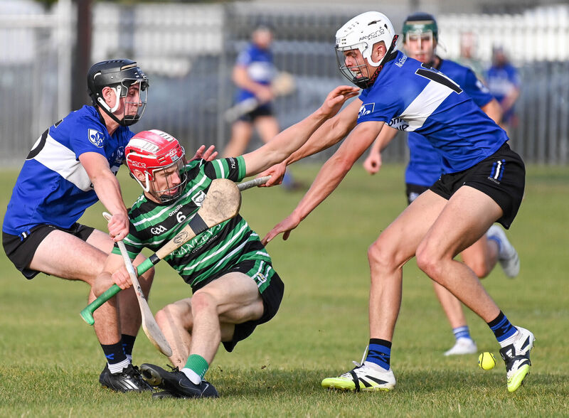Douglas' Liam Kelleher battles with Sarsfields' Harry Cogan and Adam Leahy, during their Rebel Óg Premier 1 MHC clash at Douglas. Picture: David Keane.  Douglas' Liam Kelleher battles with Sarsfields' Harry Cogan and Adam Leahy, during their Rebel Óg Premier 1 MHC clash at Douglas. Picture: David Keane.