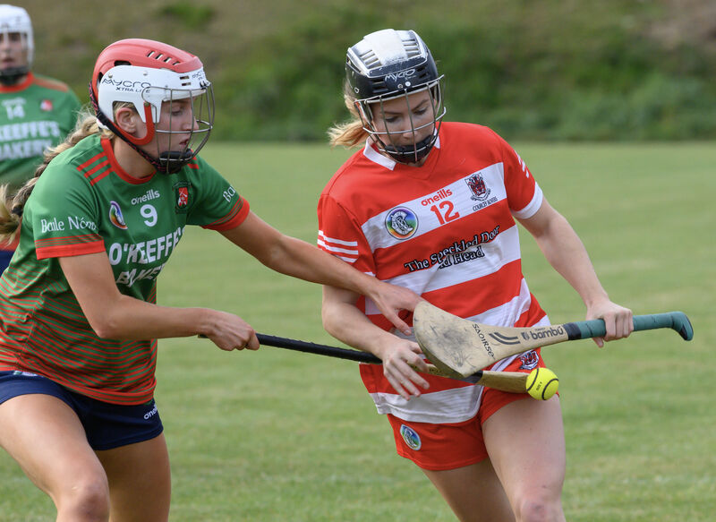  Aoife Quirke, Ballinora getting in a tackle on Saoirse McCarthy, Courcey Rovers during their SE Systems Cork senior camogie championship match at Inniscarra. Picture Dan Linehan