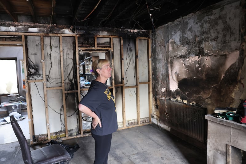 Breda Curran looks at the damage to her home after the arson attack. Photograph: Dara Mac Dónaill/The Irish Times