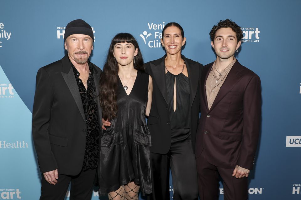 Levi Evans with his parents The Edge and Morleigh, and sister Sian. Photo: Getty