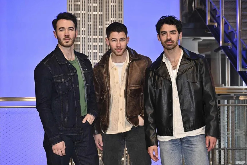 Nick Jonas, Kevin Jonas and Joe Jonas pose together.