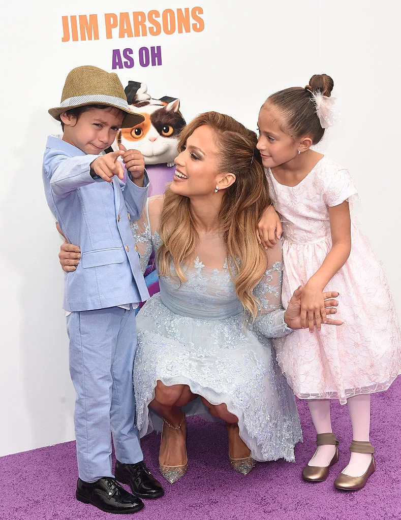 WESTWOOD, CA - MARCH 22: Recording Artist/actress Jennifer Lopez (C) and son Maximilian David Muniz (L) and daughter Emme Maribel Muniz (R) arrive at Twentieth Century Fox And Dreamworks Animation's 'Home' Premiere at Regency Village Theatre on March 22, 2015 in Westwood, California. (Photo by Jason Merritt/Getty Images)