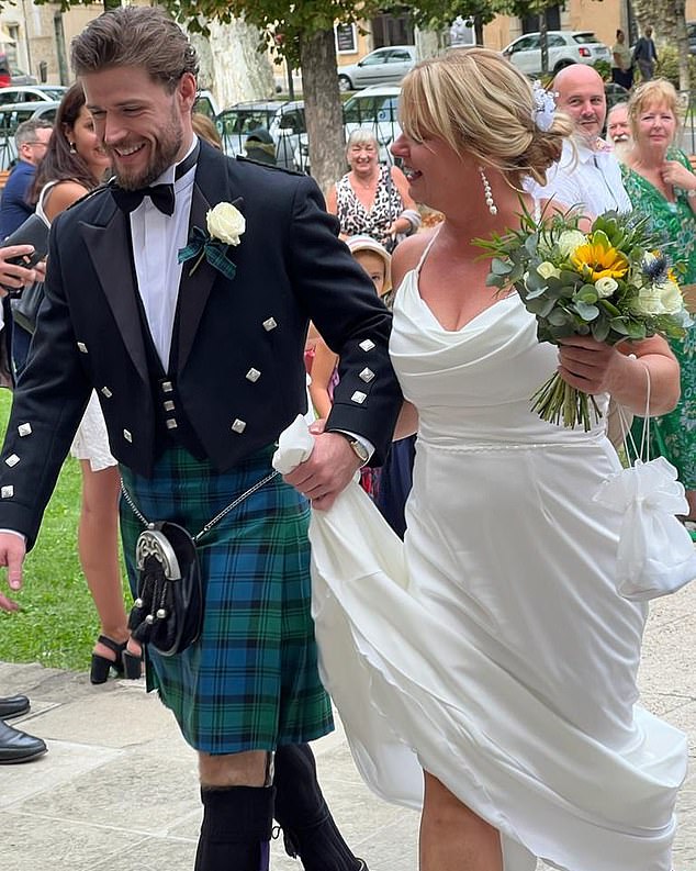 Callum Kerr walks his mother Dawn down the aisle for her marriage to Mr Searle in 2023