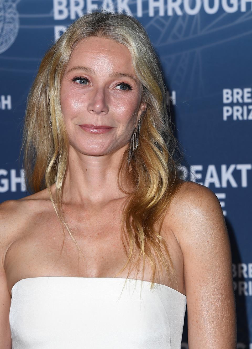 Gwyneth Paltrow in a strapless gown poses at the Breakthrough Prize event