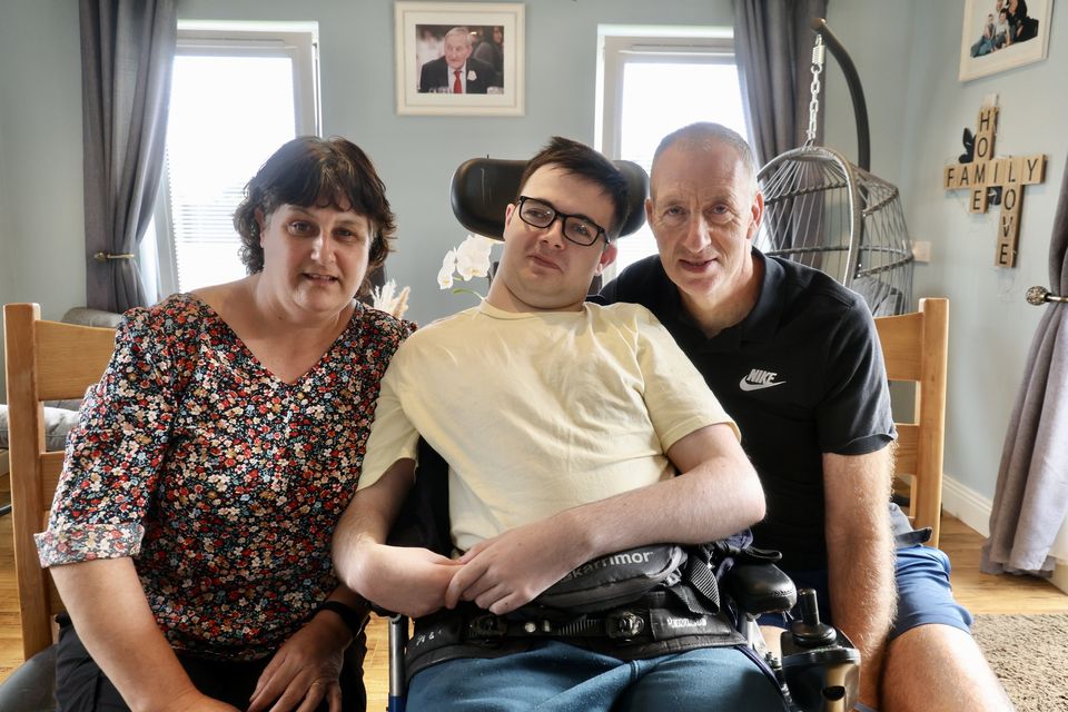 Ronan Foley pictured with his parents Tony and Caroline in their home in Killorglin. Photo by Michael G Kenny