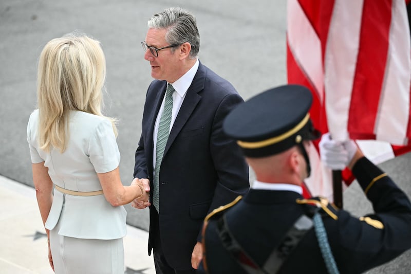 British Prime Minister Keir Starmer is greeted by US Chief of Protocol Monica Crowley.
Photograph: Mandel Ngan/AFP via Getty Images          