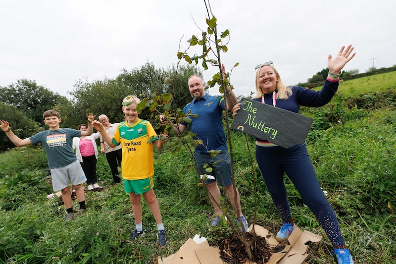 Jacob McEntee, Helen Meere, Thomas Mackey, Sean Gannon, Shane Lenihan and Roisin Ni Gháirbhith at the Inagh Nuttery, where they are planting native Irish hazel trees and will harvest the nuts to make butter. Photograph: Eamon Ward