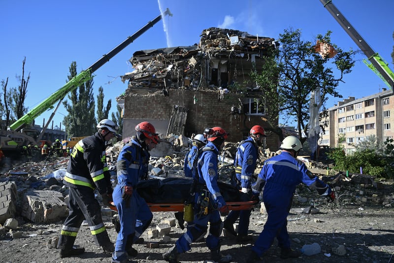 Ukrainian rescuers carry a body recovered at the site of a residential building, heavily damaged by a Russian missile strike in Kyiv on August 28th, 2025. Photograph: Genya Savilov/AFP via Getty Images
