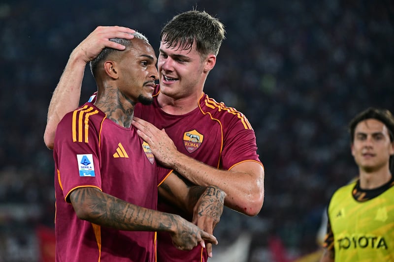 Evan Ferguson congratulates Wesley Franca after he scored Roma's goal in the Serie A win over Bologna in Rome. Photograph: Tiziana Fabi/AFP via Getty Images     