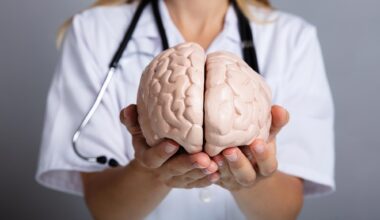 Doctor Holding Brain Model
