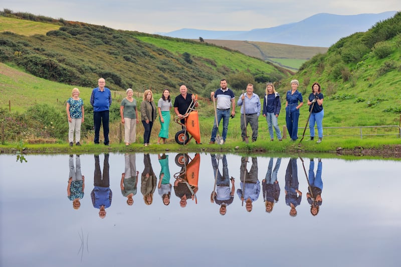 Members of one of three Dingle peninsula Sustainable Energy Communities at a newly created biodiversity pond, supported by the ReFarm project, on dairy farmer Dinny Galvin's farm, Lios Póil. Photograph: Valerie O'Sullivan
