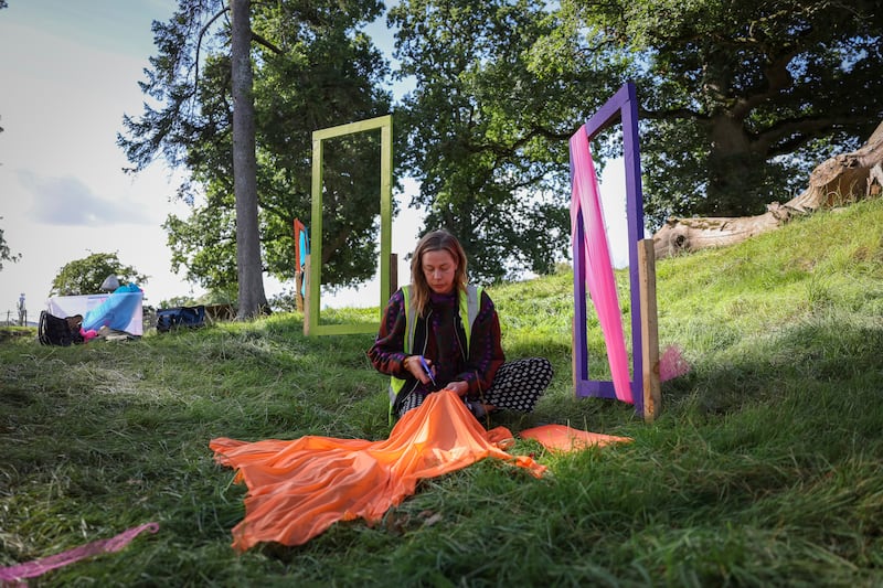 Aimée Trayer from the festival's prop and decorating team at work on the Croí stage. Photograph: Dan Dennison