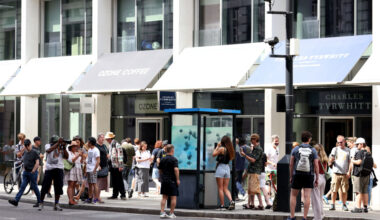 LONDON, ENGLAND - AUGUST 11: A general view as members of the public photograph and take selfies with an Artwork featuring a school of fish by Banksy, adorns a City of London Police Box on Ludgate Hill on August 11, 2024 in London, England. The elusive street artist posted a picture of the artwork earlier today on his Instagram account, his usual method of claiming credit. It came after he debuted six other works in London in as many days. It was the seventh new animal-themed artwork debuted in London this week by the elusive street artist. (Photo by Ryan Hiscott/Getty Images)