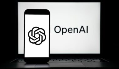 the logos of Open AI displayed on both computer and smart phone screen