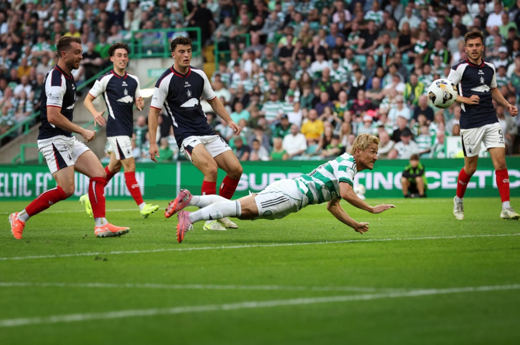 Daizen Maeda of Celtic scores his team's opening goal during the Premier Sports League Cup match between Celtic and Falkirk at Celtic Park