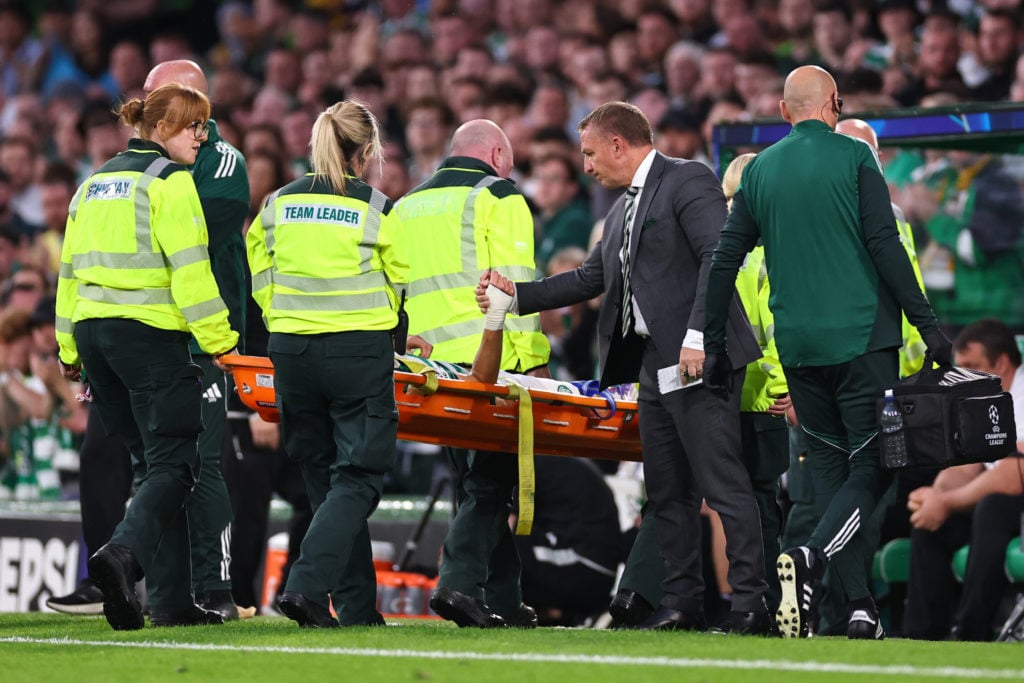 Brendan Rodgers consoles Alistair Johnston after he is stretchered off