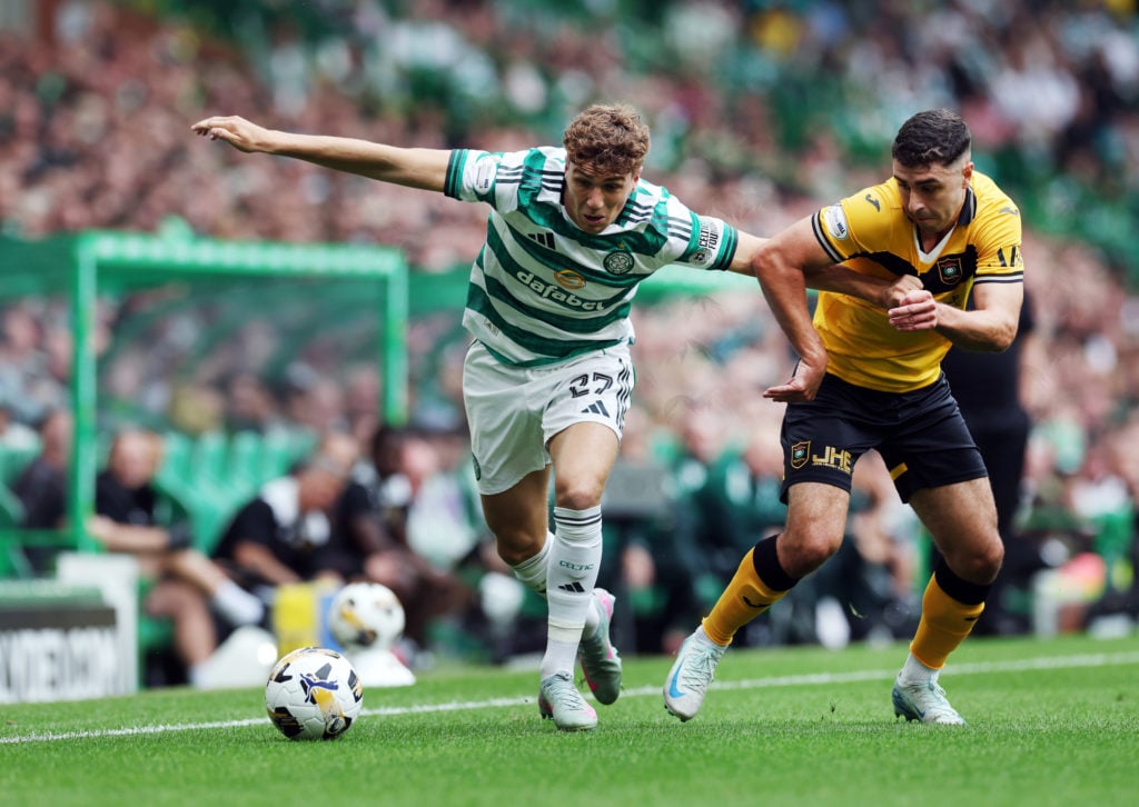Arne Engels of Celtic vies with Andy Winter of Livingston during the Premier League match between Celtic and Livingston at Celtic Park