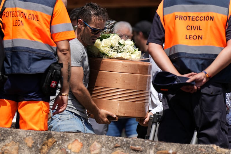 The coffin of Jaime Aparicio Vidales, who died in the wildfire in Molezuelas de Carballeda, is carried after his funeral in Quintanilla de Florez. Photograph: Getty Images  