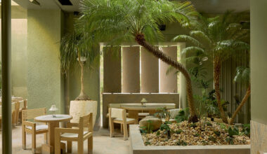 J.AR office brings brutalist garden restaurant with green-tiled surfaces to brisbane