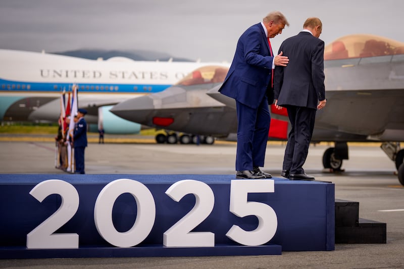Presidents Trump and Putin walk down from the 'Alaska 2025' platform towards their waiting car ahead of talks focused on peace in Ukraine. Photograph: Andrew Harnik/Getty Images