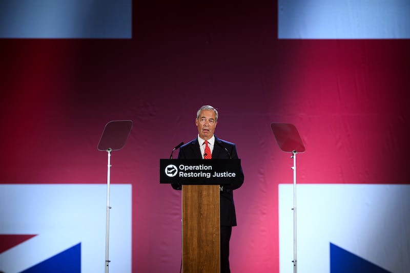Nigel Farage speaks on stage during the Reform UK deportations policy announcement. Photograph: Leon Neal/ Getty Images