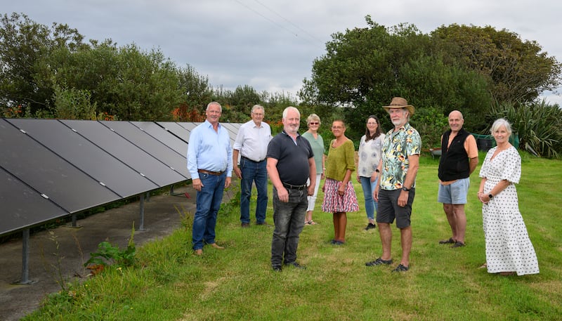 Chris Maxwell, Michael Tiernan, Richard Mannion, Rosarie Tiernan, Miriam Toyterdell, Mary O'Malley, James Ryan, Paul Butler and Áine Moran of Climate Action Louisburgh Locality at one of their solar PV installations. Photograph: Michael McLaughlin