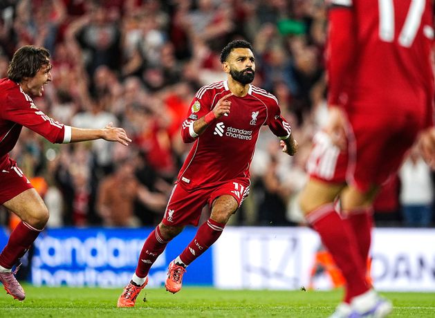 Liverpool’s opening night marred by racist incident as late show from Chiesa and Salah foils Bournemouth comeback