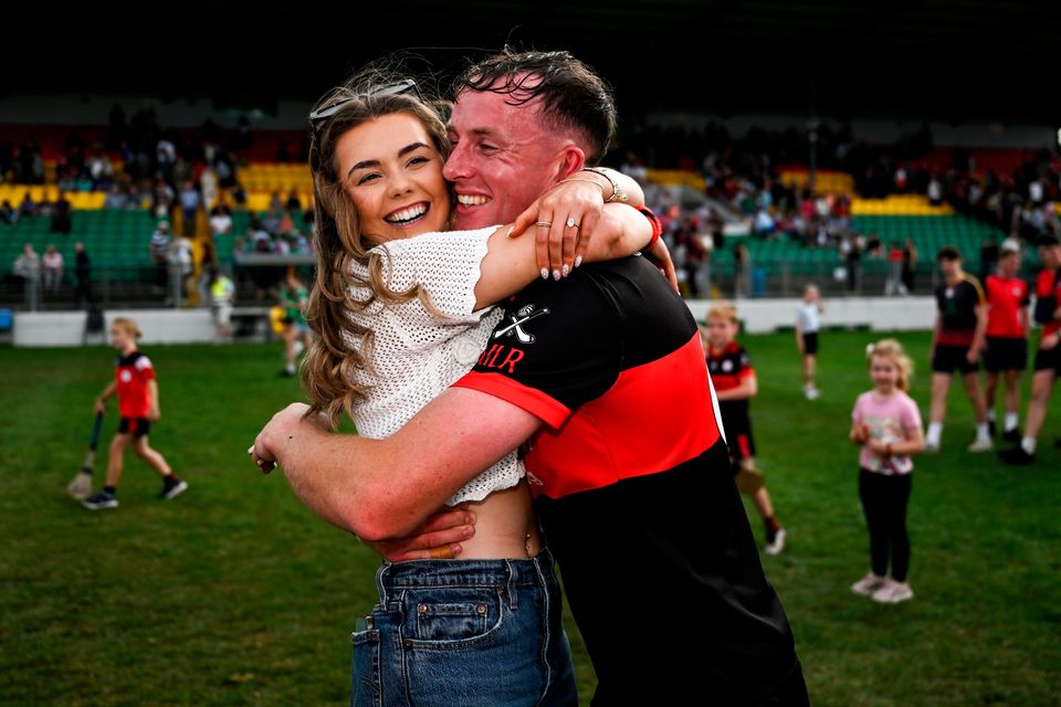 Mount Leinster Rangers captain Kevin McDonald celebrates with his partner Vanessa Curran after beating St Mullins in the Carlow SHC final at Netwatch Cullen Park. Photo: Brendan Moran/Sportsfile
