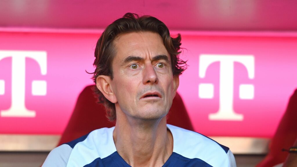 Tottenham boss Thomas Frank watches on