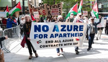 Pro-Palestinian demonstrators hold banners and signs as they protest outside the Microsoft Build conference.