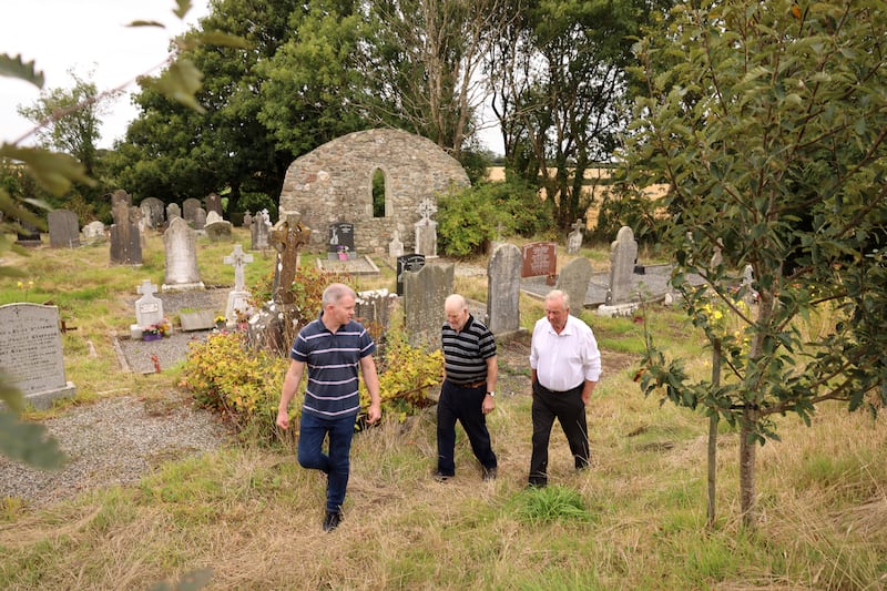 Donal Keane with Mathew Stafford and Sean Sinnott, volunteers at Ambrosetown Graveyard, in the Parish of Rathangan, Co Wexford. Photograph: Dara Mac Dónaill/The Irish Times










