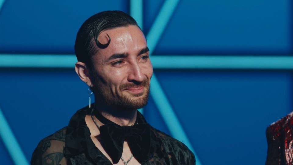 Project Runway contestant smiling.