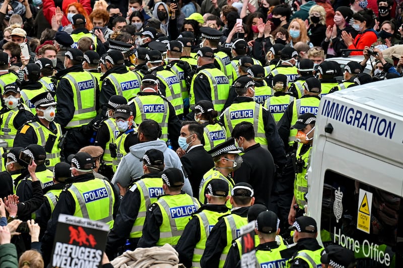 Protesters block an immigration van in Pollokshields, Glasgow, in May, 2021. Photograph: Jeff J Mitchell/Getty Images