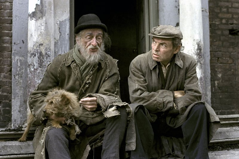 Rashers Tierney (David Kelly) with his terrier dog Rusty and ‘Toucher’ Hennessy (Brendan Cauldwell) sit on the steps of a tenement house on Dublin’s Henrietta Street in the drama series Strumpet City. Photograph: Mary Lee/RTÉ