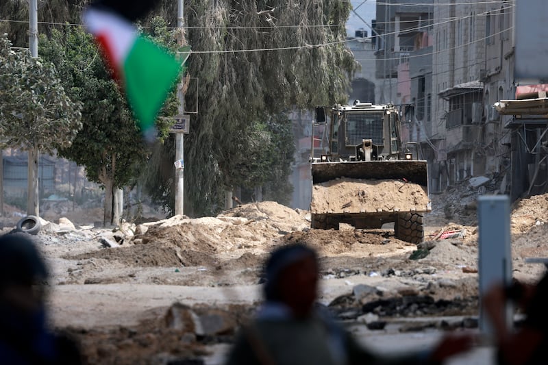 An Israeli army bulldozer digging up a road in the Nur Shams refugee camp in Tulkarem last year. Photograph: Jaafar Ashtiyeh/AFP