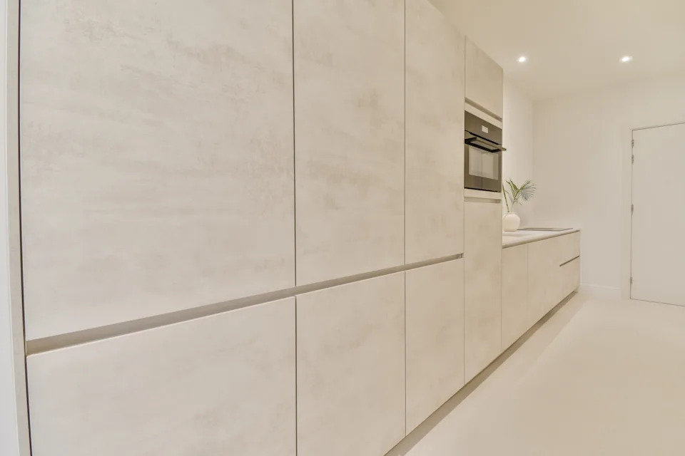 interior of modern kitchen with white cabinets