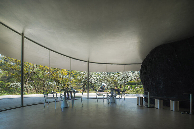 archermit sculpts 'stone kiln in the valley' with petal shaped roof in luzhou