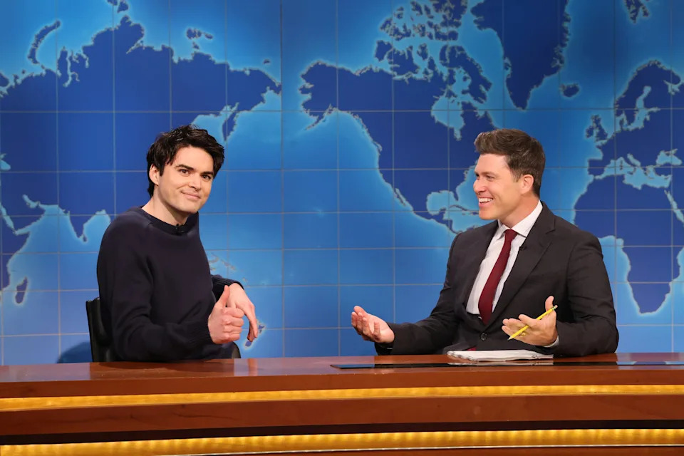 Michael Longfellow, pictured with Colin Jost, had tested for the Weekend Update chair before being let go. / NBC / Will Heath/NBC via Getty Images