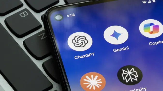 A photo of generative AI apps on a cellphone, featuring ChatGPT, Gemini, Copilot