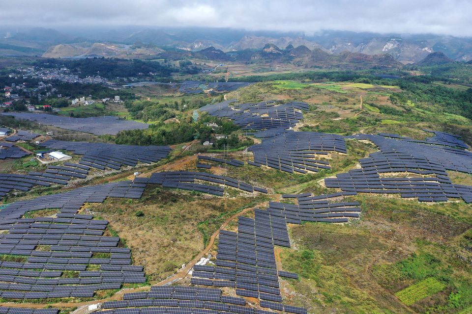 Solar panels covering hills at a site in Anlong County, south-west China. Photo: Getty