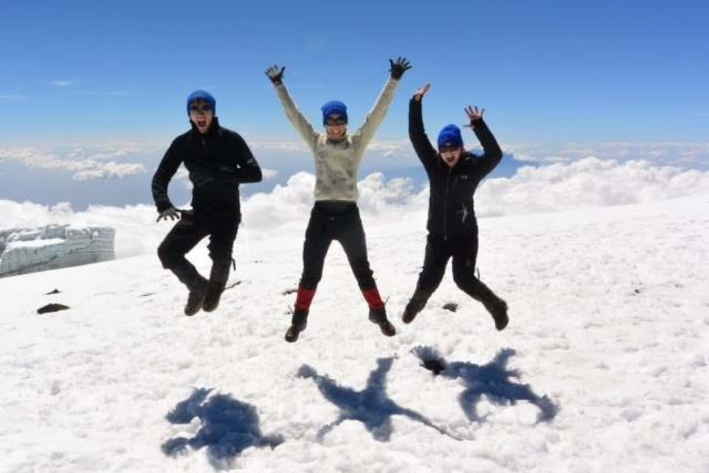 Larkin and her children celebrate climbing Mount Kilimanjaro in 2013. But it was on this trip that she first felt a large mass in her breast. Photo: Facebook/UCHealthCincinnati